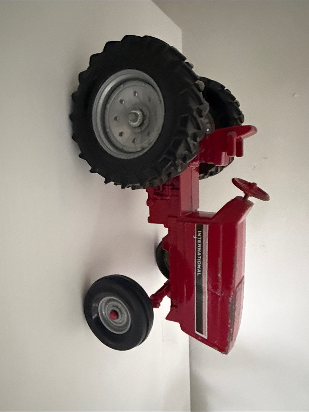 26 International Red Pedal Tractor Toy with Black Wheels